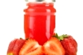 Jar of strawberry jam isolated on white background. Preserved fruits